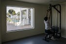 A Wuhan Zall F.C. players uses a weight machine at a luxury hotel where they are staying while training, in Marbella, Spain, March 12, 2020. The team 