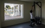 A Wuhan Zall F.C. players uses a weight machine at a luxury hotel where they are staying while training, in Marbella, Spain, March 12, 2020. The team 