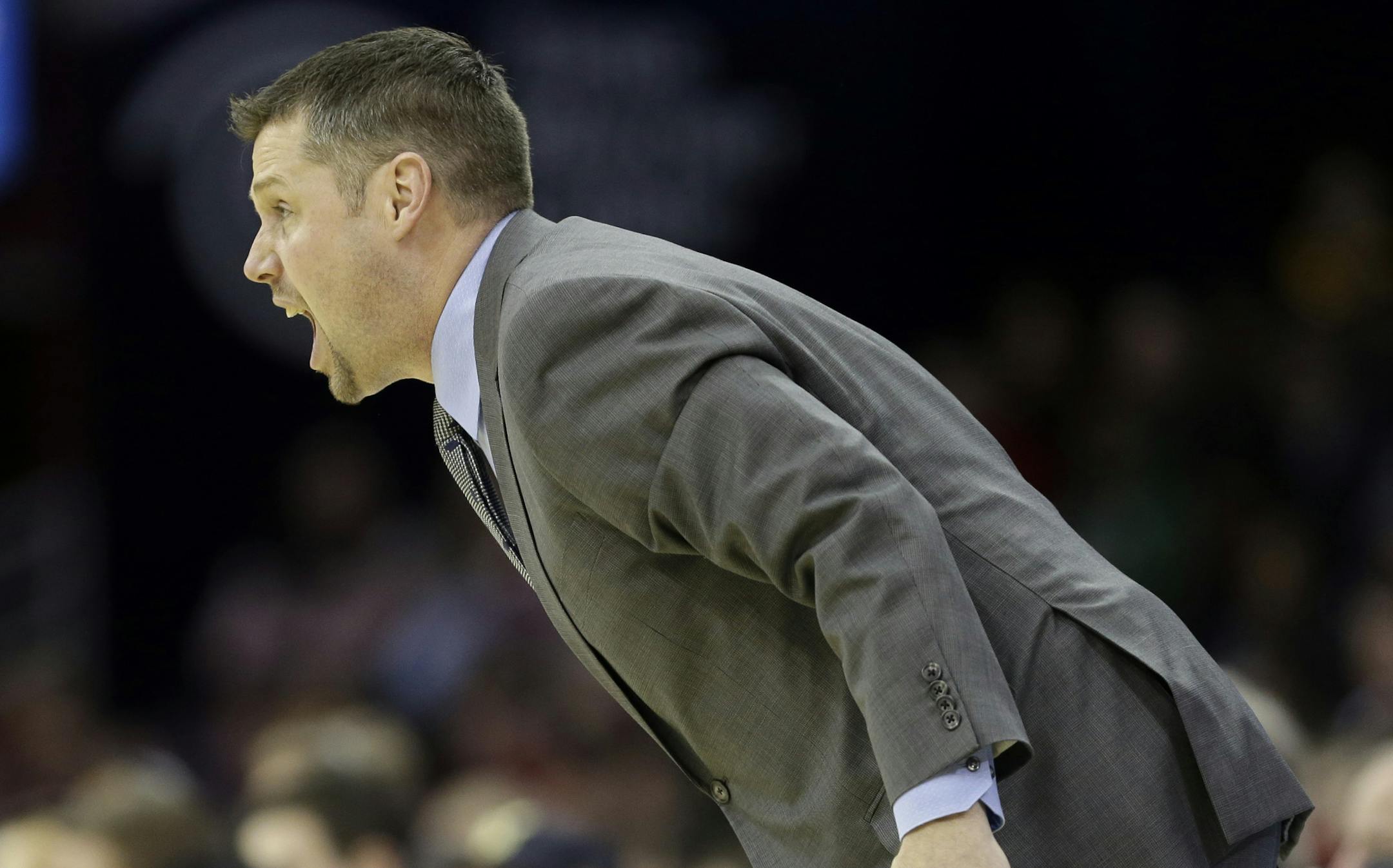 Memphis Grizzlies head coach David Joerger yells at his players in an NBA basketball game against the Cleveland Cavaliers Sunday, Feb. 9, 2014, in Cleveland. (AP Photo/Mark Duncan) ORG XMIT: CDA