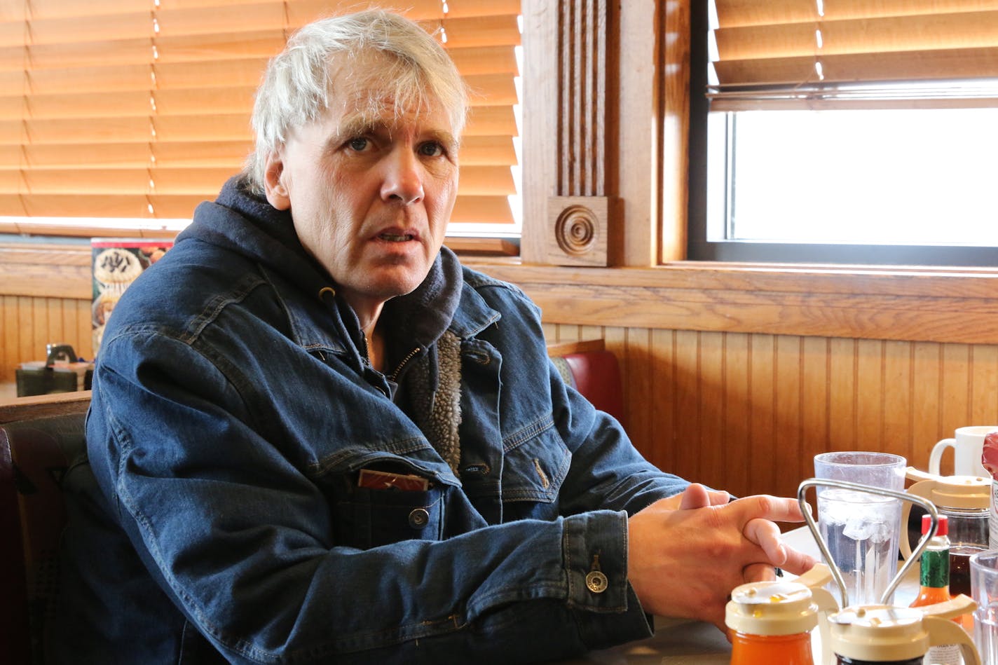 Keith Adams, whose schizophrenia has placed him under the supervision of a court-appointed financial caretaker called a conservator, enjoys a breakfast outing near his home in Austin, Minn., with his sister Cindy Coffin.