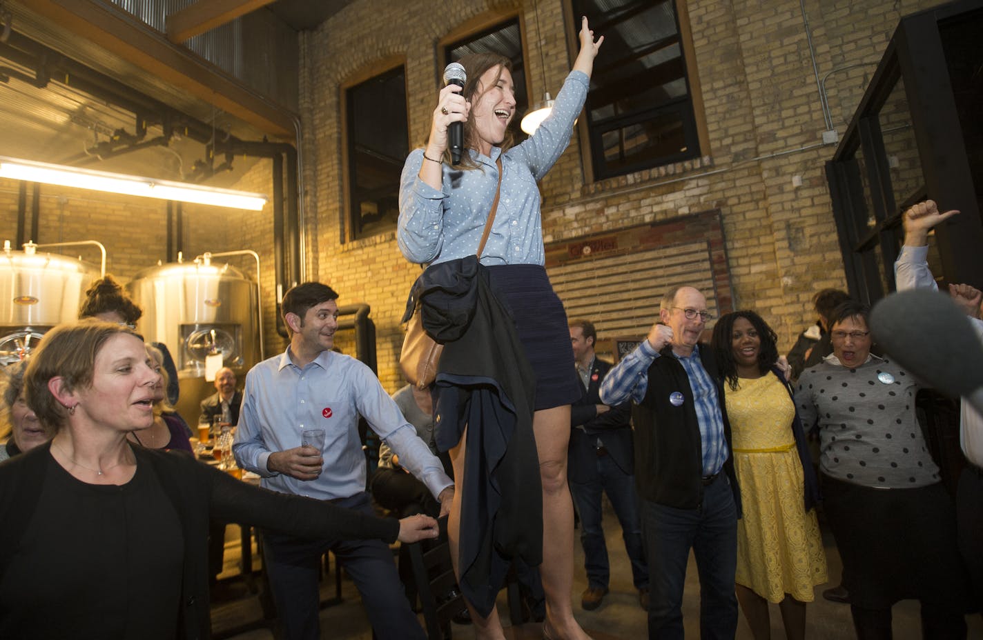 Saint Paul DFL Chair Libby Kantner stood on a stool to address the crowd at the DFL election party at Urban Growler Tuesday night. ] (AARON LAVINSKY/STAR TRIBUNE) aaron.lavinsky@startribune.com All seven of St. Paul's City Council seats are up for election, including two open wards where incumbents didn't run again. As many as three who have challenged Mayor Chris Coleman's goals and strategies have a chance of winning.The DFL held an election party at Urban Growler on Tuesday, Nov. 3, 2015 in S