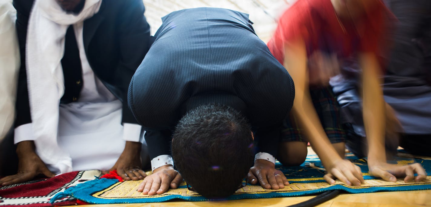 Younes Elidrissi of Minneapolis prayed with fellow worshipers. ] Mark Vancleave - mark.vancleave@startribune.com * Twin Cities Muslims gathered for prayers during Eid ul-Fitr, marking the end of the holy month of Ramadan, at the Mounds View Community Center on Friday, July 17, 2015.