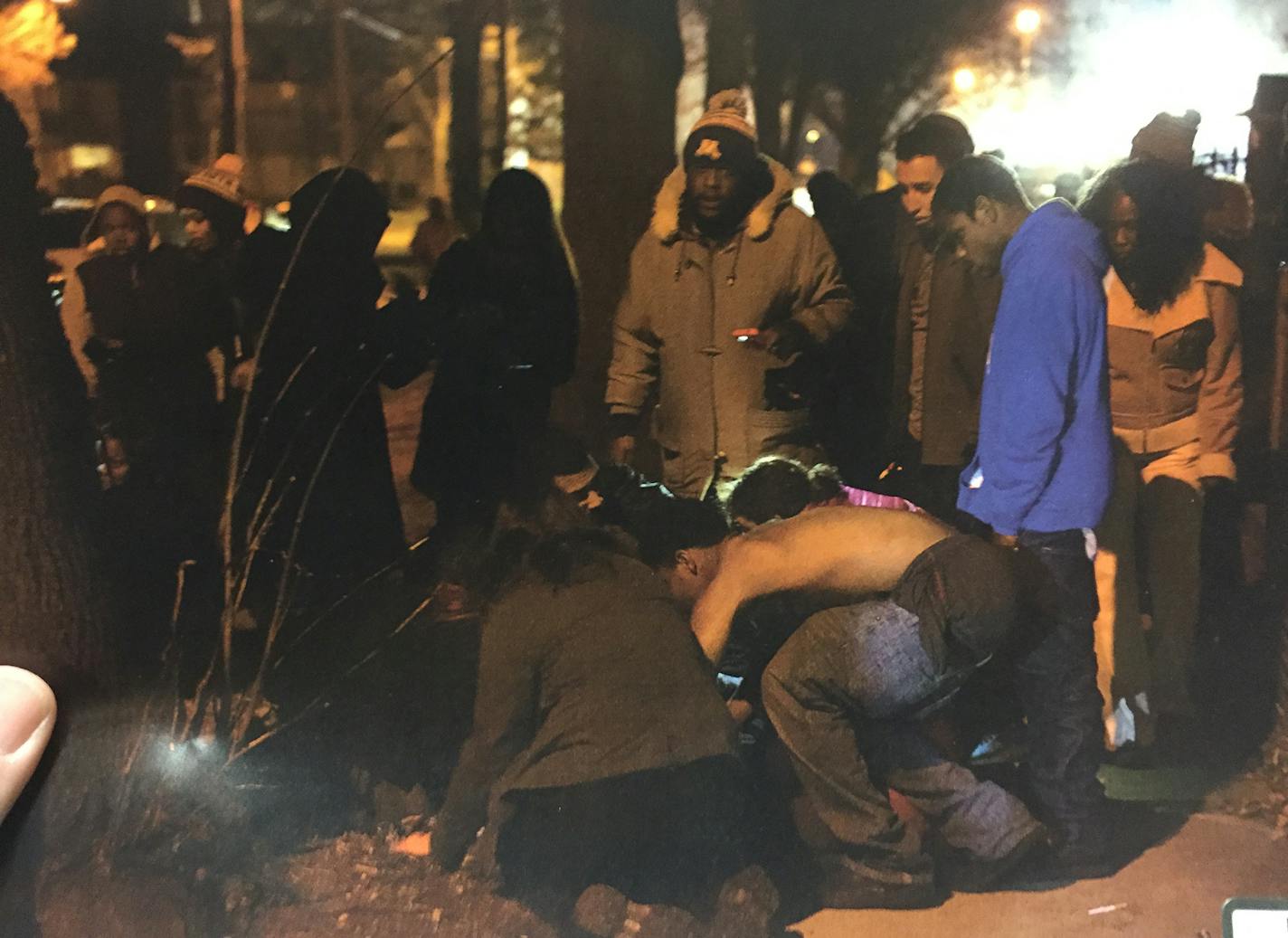 The immediate aftermath of the shooting shows several protesters attending to the victims shot by Scarsella.