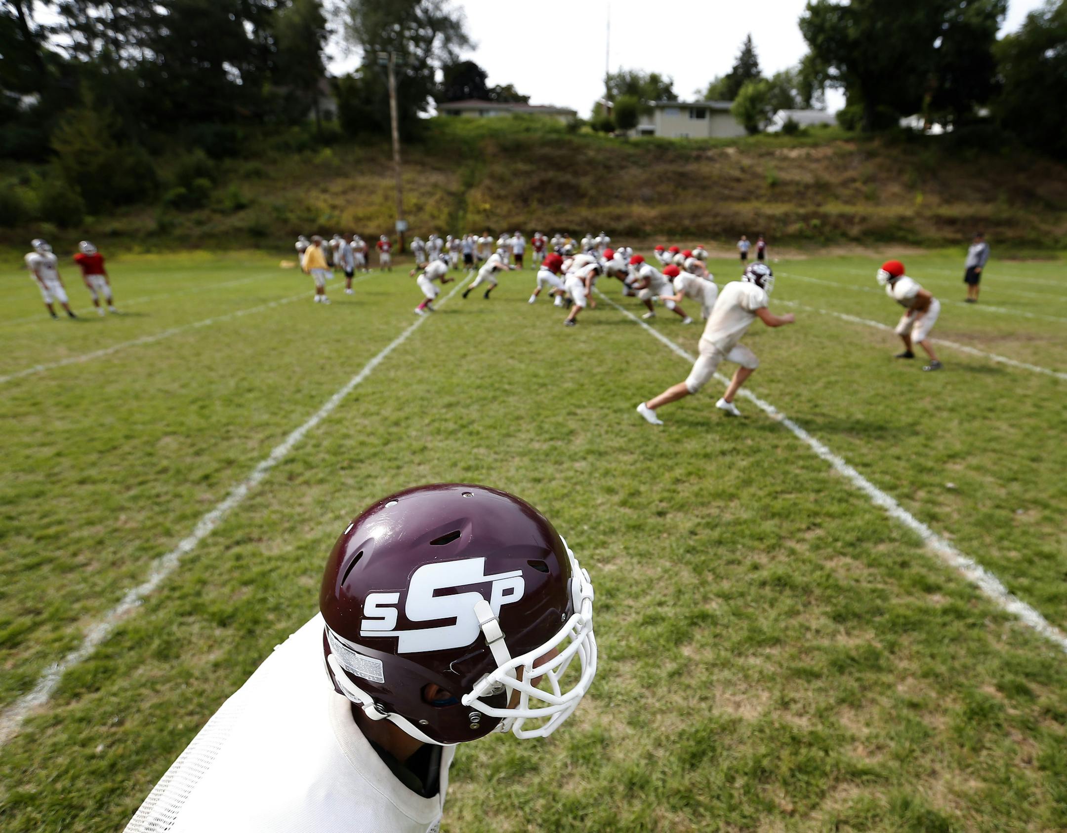 The South St. Paul high school football team practiced on Wednesday. ] CARLOS GONZALEZ cgonzalez@startribune.com - August 20, 2014 , South St. Paul, Minn, Prep High School Football, Coach Chad Sexauer