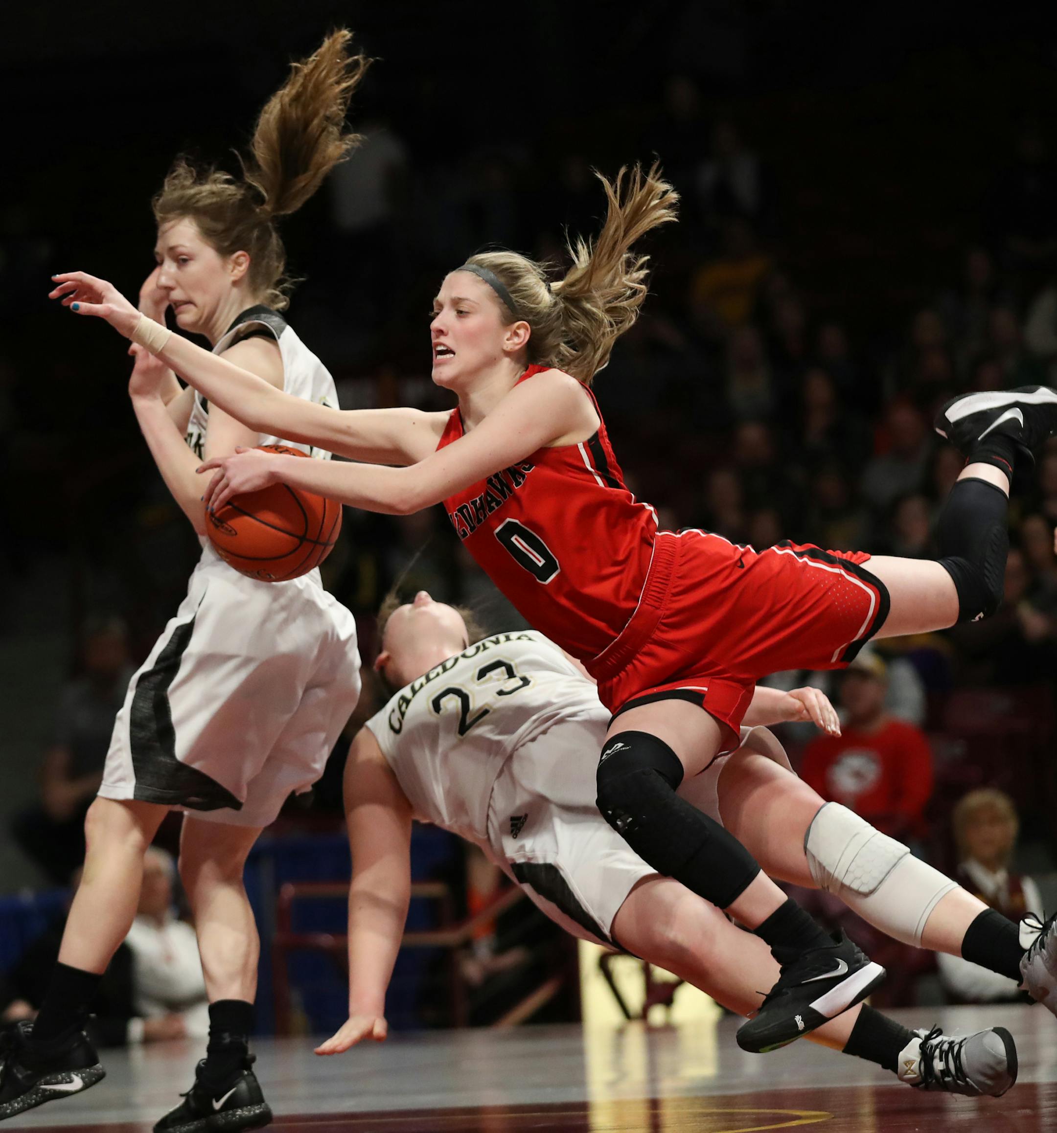 As Minnehaha Academy guard Taytum Rhoades (0) drove to the basket, she ran into Caledonia guards Katie Tornstrom (23) Kaitlin Conniff (12). ] Shari L. Gross • shari.gross@startribune.com Minnehaha Academy defeated Caledonia 72-63 to claim the Class 2A state girls basketball championship title on Saturday, March 16, 2019 at Willams Arena on the University of Minnesota campus in Minneapolis.