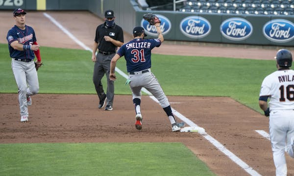 Twins starting pitcher Devin Smeltzer (31) got catcher Alex Avila (16) out at first in the third inning of a scrimmage at practice at Target Field in 