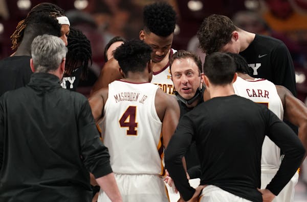 Minnesota head coach Richard Pitino talked with his team ahead of the first half.