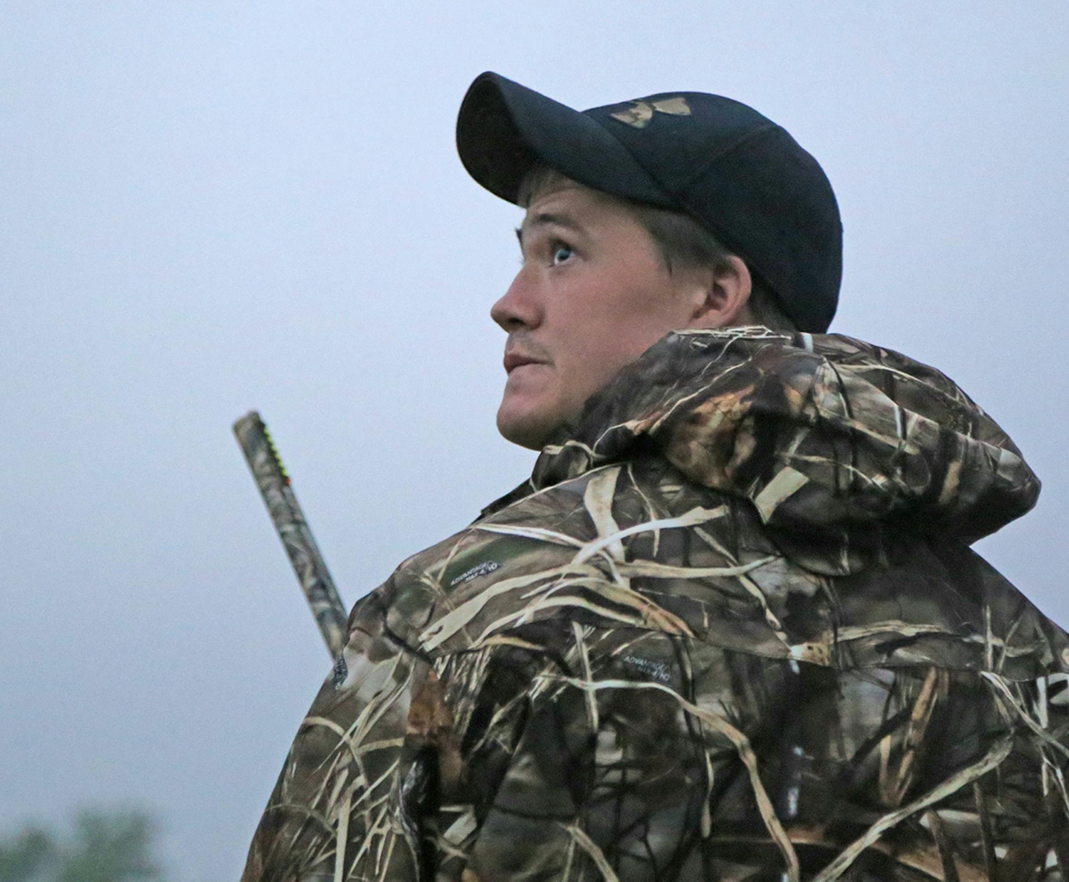 Trevor Unruh watched for ducks on Saturday, opener of the 2016 Minnesota duck season. He was hunting Pelican Lake near St. Michael.
