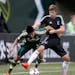 Minnesota United FC's Collin Martin and Portland Timbers' Marco Fargan battled for the ball in the first half.