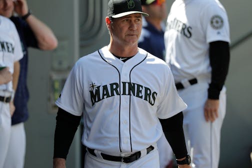 Seattle Mariners manager Scott Servais walks in the dugout during the eighth inning of a baseball game against the Minnesota Twins, Sunday, May 27, 2018, in Seattle. The Mariners won 3-1 and swept the series against the Twins. (AP Photo/Ted S. Warren)
