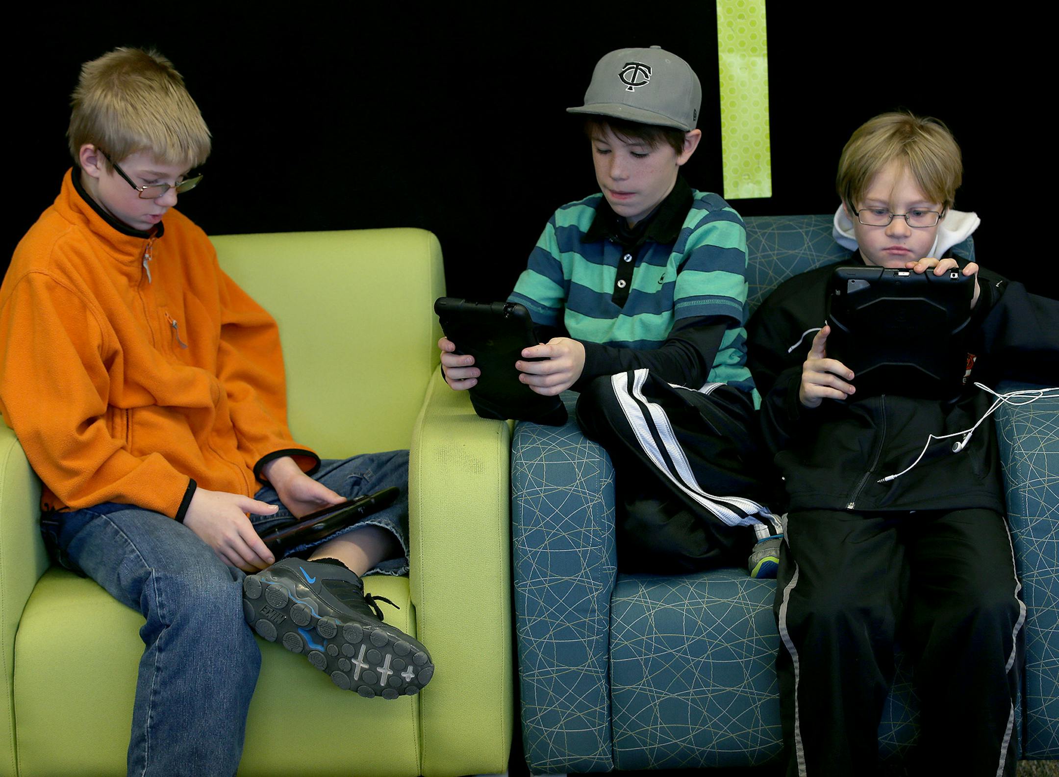 Ethan Neurauter, 12, left, Jacob Buchman, 11, center, and Gavyn Lewis, 11, worked on researching their hero JJ Abrams for a class project at Gateway Academy, Wednesday, December 17, in Farmington, MN. ] (ELIZABETH FLORES/STAR TRIBUNE) ELIZABETH FLORES • eflores@startribune.com