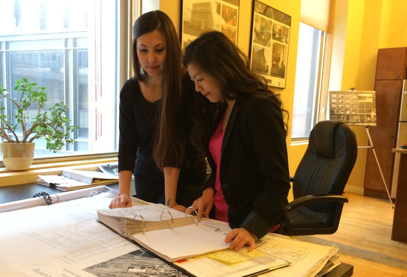 Lindsey Johansen (left), office manager Crowe Construction Management; and Kaoly Her, Right Track intern at Crowe from St. Paul's Washington Technology Magnet School (Class of 2016).