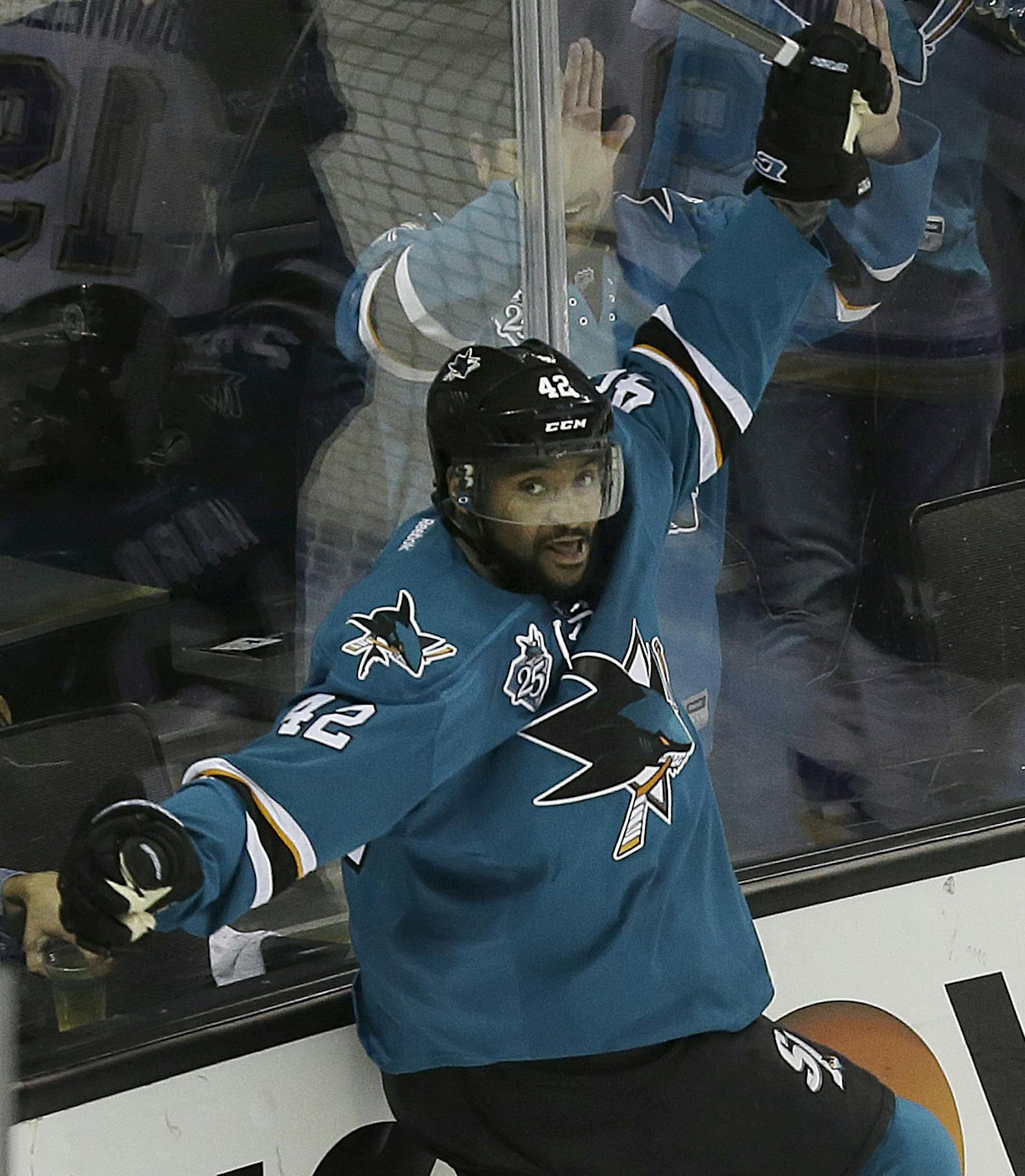 San Jose Sharks right wing Joel Ward (42) celebrates after scoring against the St. Louis Blues during the third period in Game 6 of the NHL hockey Stanley Cup Western Conference finals in San Jose, Calif., Wednesday, May 25, 2016. The Sharks won 5-2. (AP Photo/Jeff Chiu)