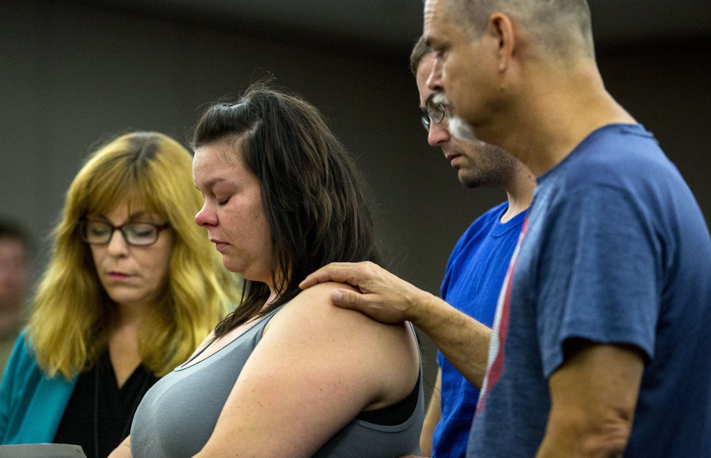 Nicolle Peltier, the mother of the injured children, pauses for a moment as she speaks to the court about the pain she and her family feels and the long road to recovery her children will face. Her father, Tim Brinkley and her husband, Kyle, both hold her to support and comfort her. ] ALEX KORMANN &#x2022; alex.kormann@startribune.com Kabaar Powell was sentenced to 33 months and one day in prison, in accordance with his plea bargain, on two criminal counts related to an incident where Powell plo