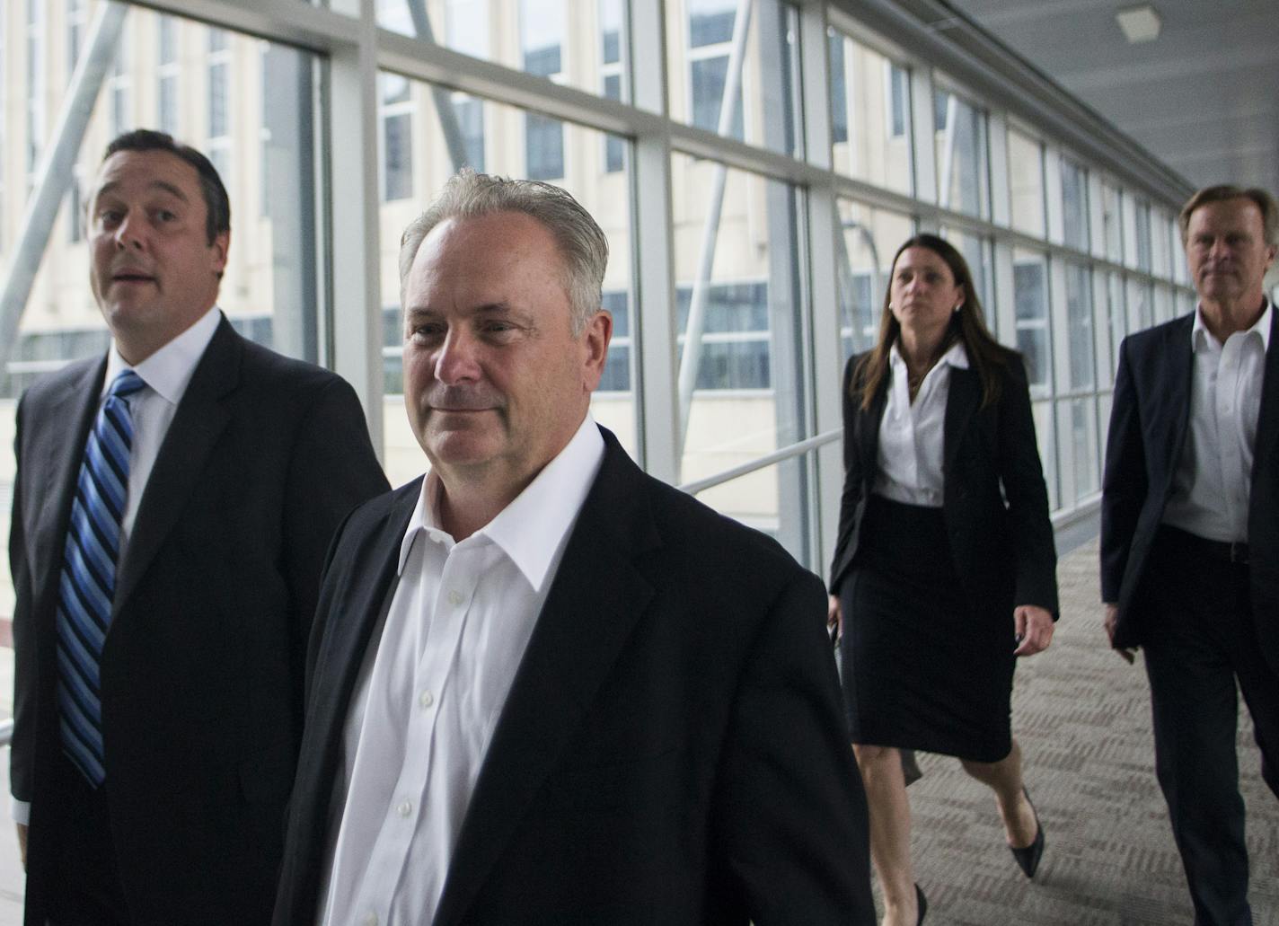 Former Starkey president Jerome C. Ruzicka and former Starkey human resources manager Larry W. Miller (far right)