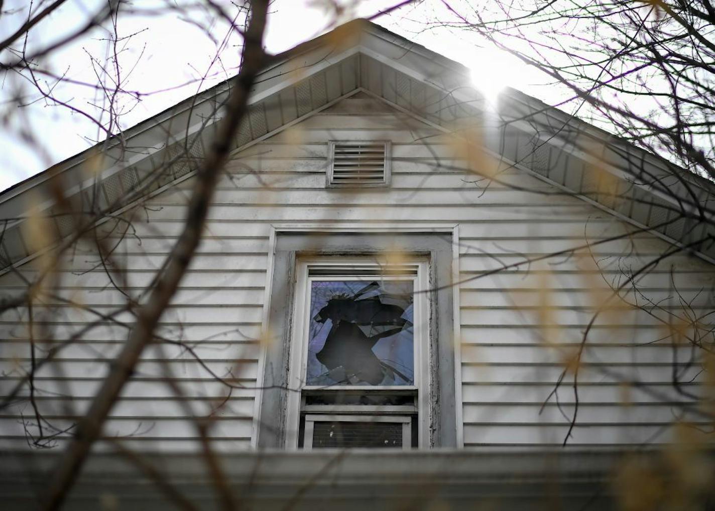 A broken window at the home of Thomas Nowak, who died in a house fire this winter in Northeast Minneapolis.