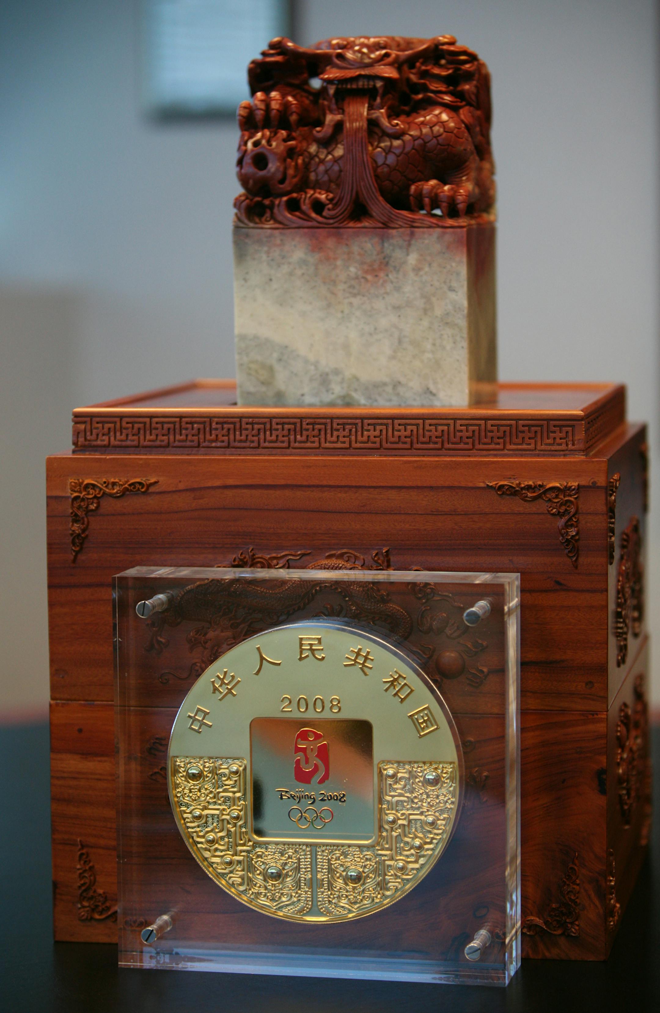 The 7-inch-wide, 22-pound coin comes in a wood-carved box crowned with a 35-pound dragon made of Shoushan stone.