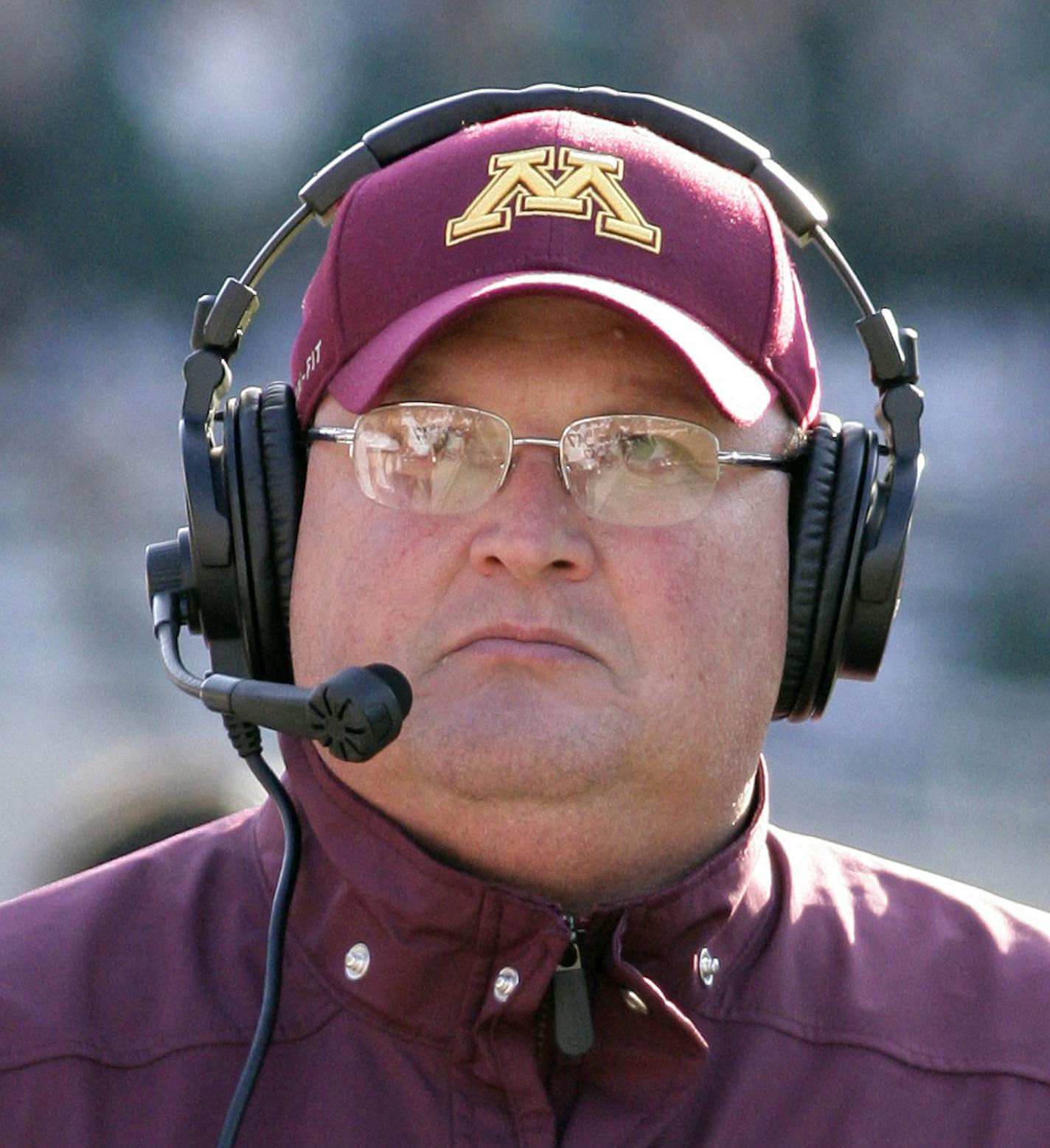 Minnesota acting head coach Tracy Claeys walks the sideline during the third quarter of an NCAA college football game against Michigan State, Saturday, Nov. 30, 2013, in East Lansing, Mich. Michigan State won 14-3. (AP Photo/Al Goldis) ORG XMIT: ELJ115