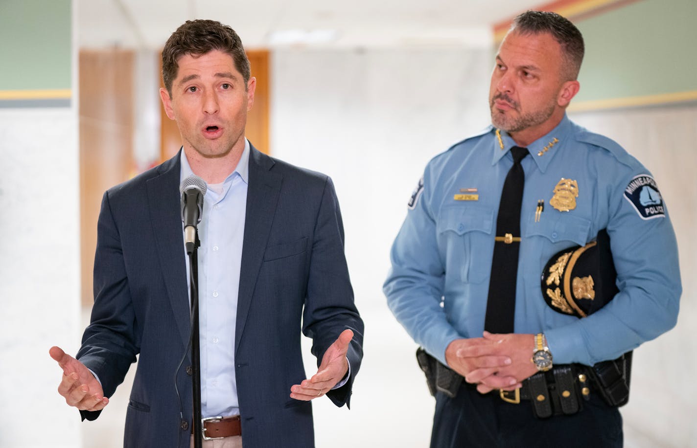 Minneapolis Mayor Jacob Frey, left, and Minneapolis Police Chief Brian O'Hara announced an agreement over funding police retention and recruitment incentives Friday at City Hall.