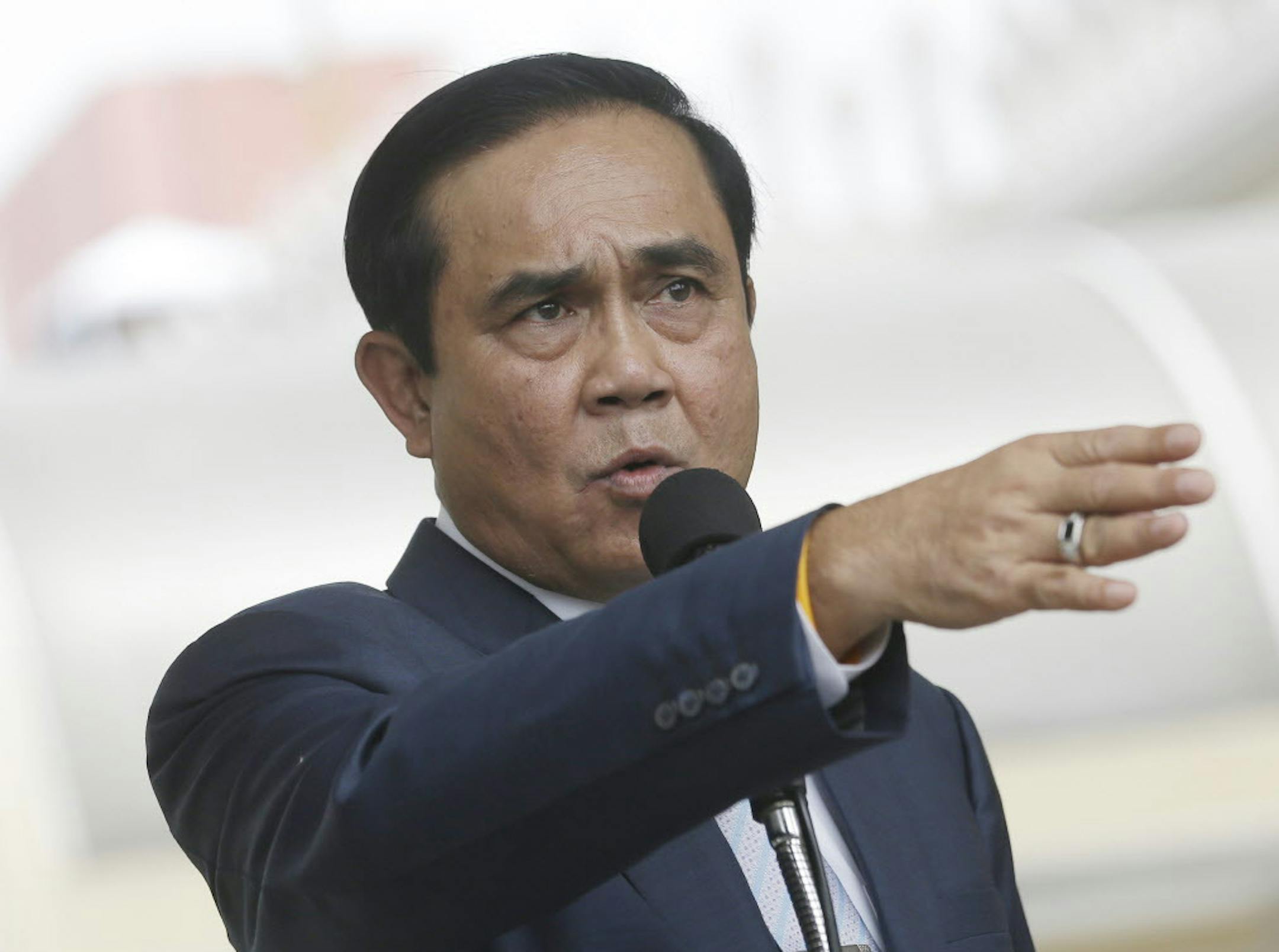 In this June 6, 2016 photo, Thailand's Prime Minister Prayuth Chan-ocha answer question from reporters at Government house in Bangkok, Thailand. The head of Thailand's military government said Monday, June 27, 2016, that he will not step down if an August referendum fails to approve a draft constitution it is promoting. (AP Photo/Sakchai Lalit)