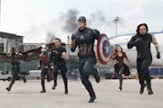 In this image released by Disney, Anthony Mackie, from left, Paul Rudd, Jeremy Renner, Chris Evans, Elizabeth Olsen and Sebastian Stan appear in a sce