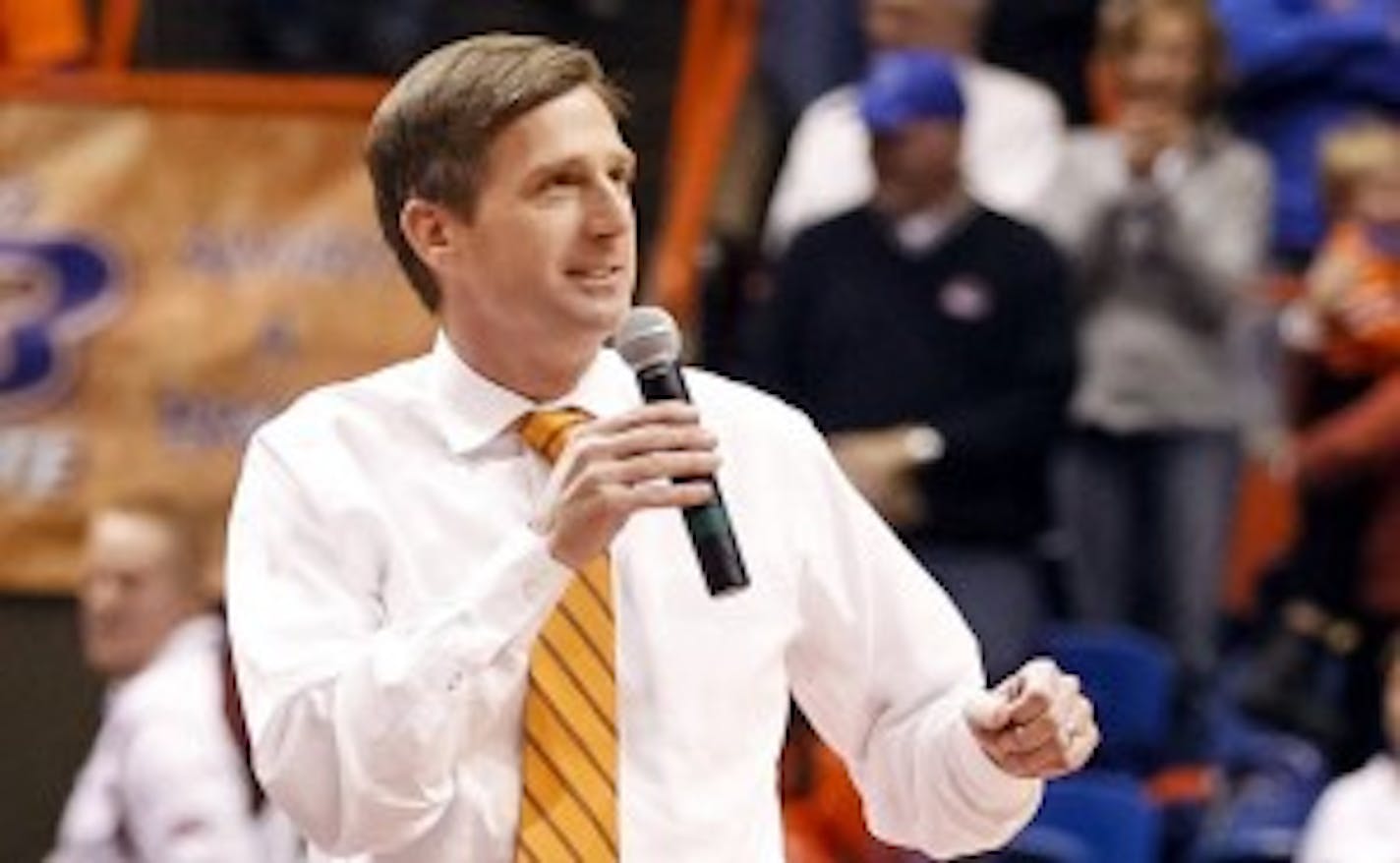 Then-Boise State athletics director Mark Coyle talks to the crowd during halftime of an NCAA college basketball game in Boise, Idaho.