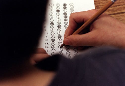 In this March 12, 1999 file photograph, a student fills in his answer to the practice test question for a standardized test, in Roswell, Georgia.