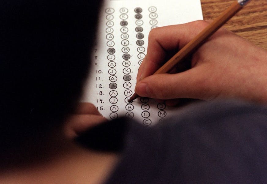 In this March 12, 1999 file photograph, a student fills in his answer to the practice test question for a standardized test, in Roswell, Georgia.
