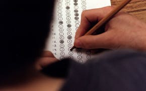 In this March 12, 1999 file photograph, a student fills in his answer to the practice test question for a standardized test, in Roswell, Georgia.