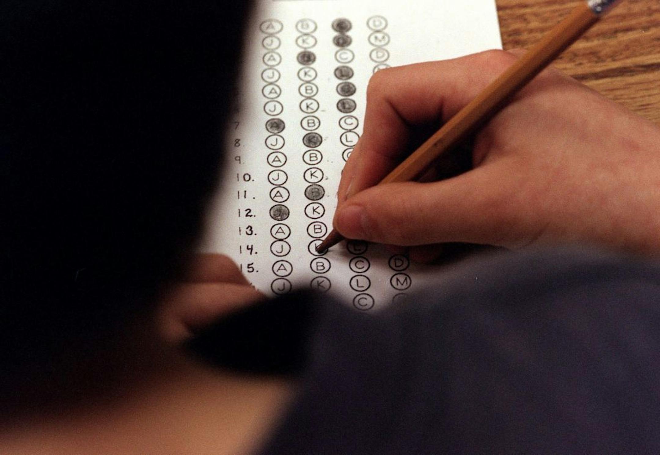 In this March 12, 1999 file photograph, a student fills in his answer to the practice test question for a standardized test, in Roswell, Georgia.