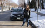 Patricia Fox stands by her vehicle, which is parked in a designated disability parking spot, in front of her Fremont Avenue home in North Minneapolis 