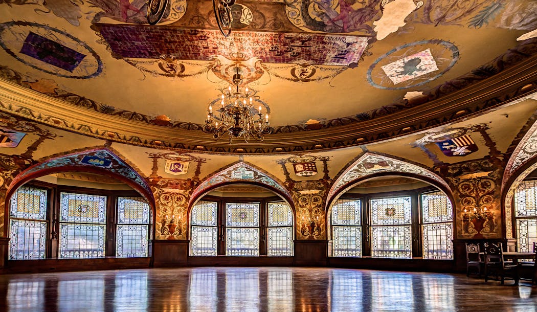 The dining hall at St. Augustine’s Flagler College boasts murals by George Willoughby Maynard and Tiffany stained-glass windows.