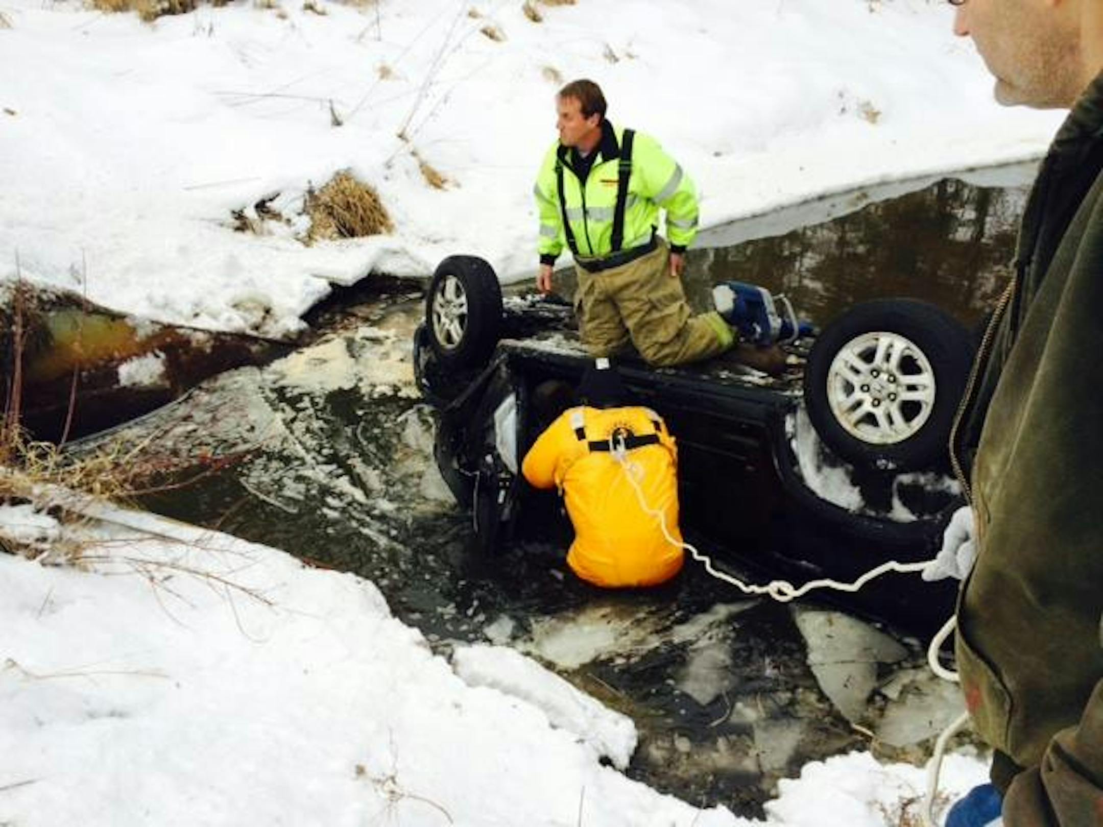 A driver was rescued from this SUV in an Isanti County creek.