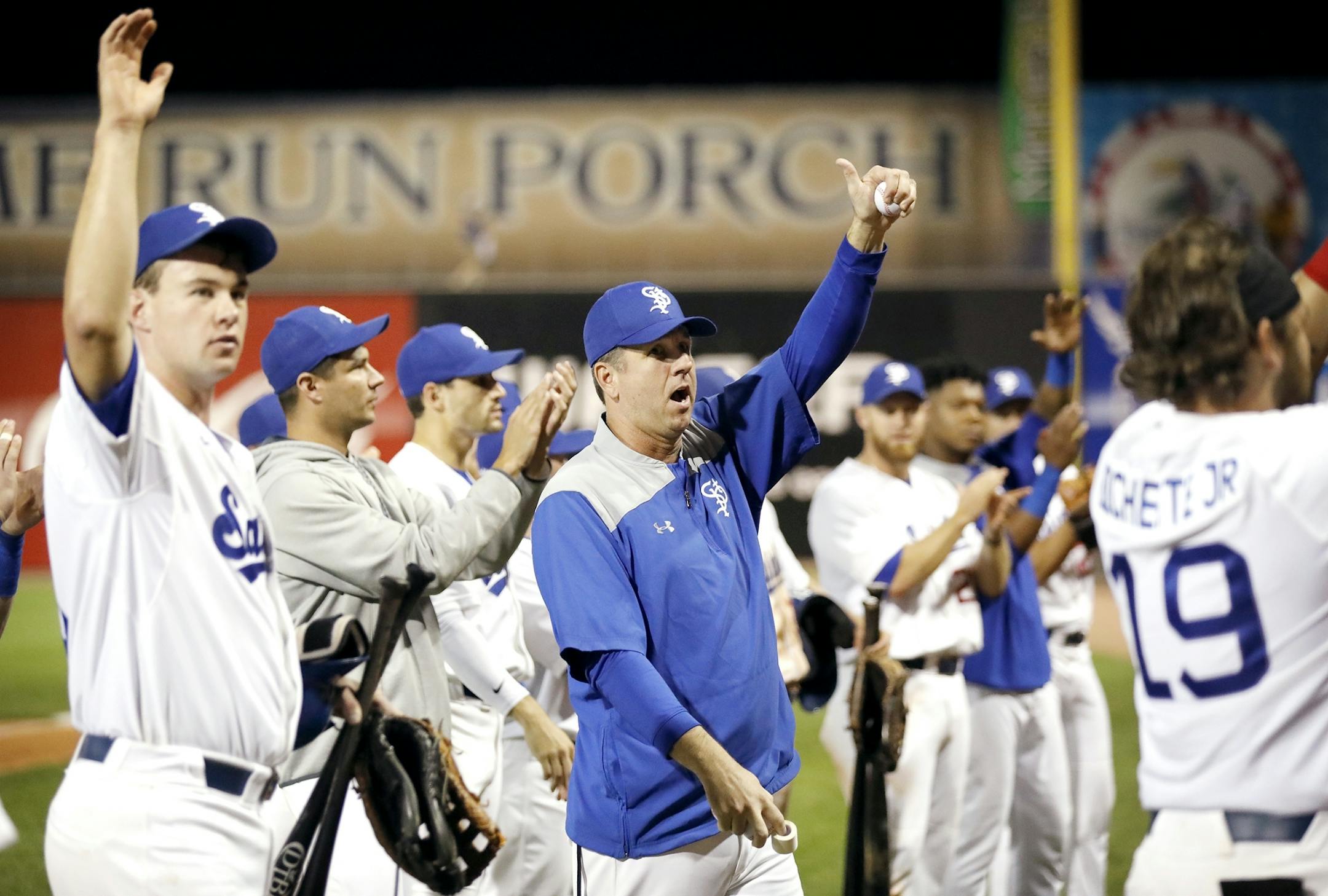 Saints manager George Tsamis, center, and the team thank the home crowd at the end of the game, the last home game of the season.