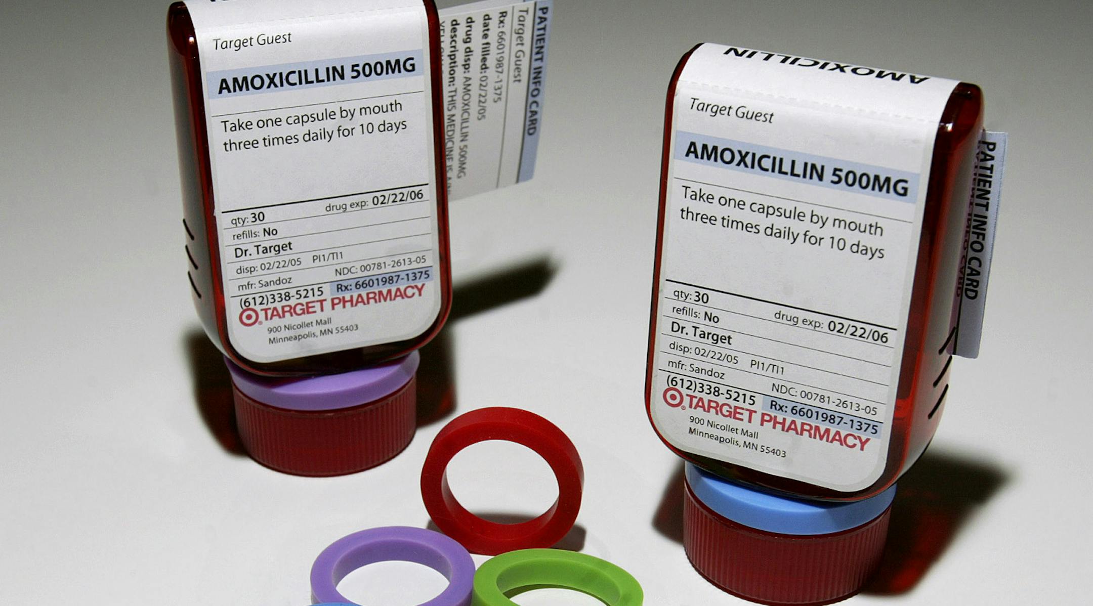 Prescription bottles and colorful rings that make up the ClearRx prescription system are shown in New York Wednesday, April 27, 2005. Target pharmacies this month rolled out the flattened bottle with easier-to-read labels and plastic rings that can color-code the bottles for each family member. (AP Photo/Gregory Bull) ORG XMIT: NY861