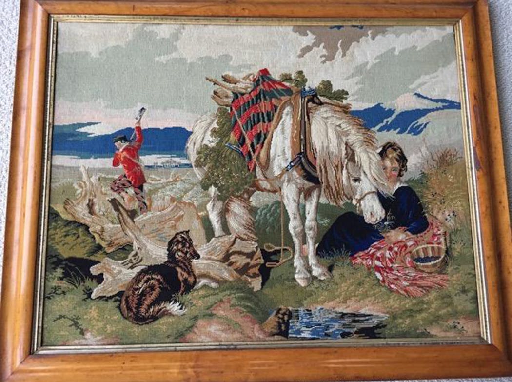 This needlework reproduces an Edwin Landseer painting.