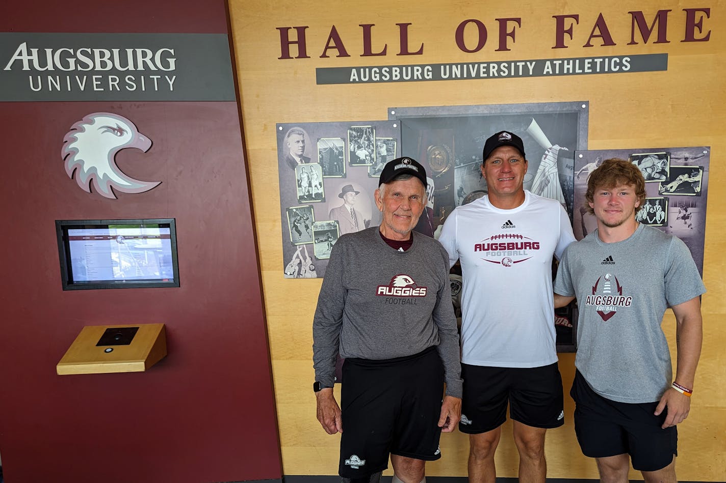 From left: Jack Osberg, Derrin Lamker and Cade Sheehan.&nbsp;Augsburg won its 2nd&nbsp;ever (and most recent) MIAC football title in 1997. Osberg was coach and Lamker was record-breaking QB. Now, Lamker is coach and Sheehan is QB, with chance to break Lamker's passing records.&nbsp;—Photo by Ausgsburg.