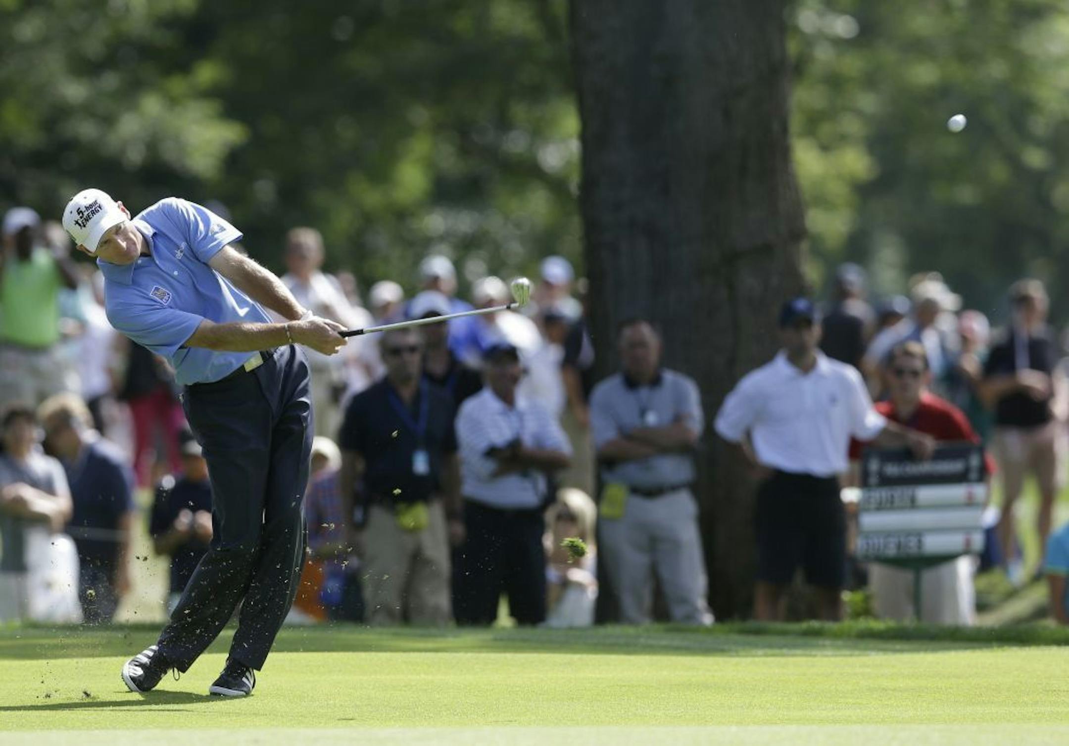 Jim Furyk hits from the fairway on the fourth hole during the final round of the PGA Championship golf tournament at Oak Hill Country Club, Sunday.