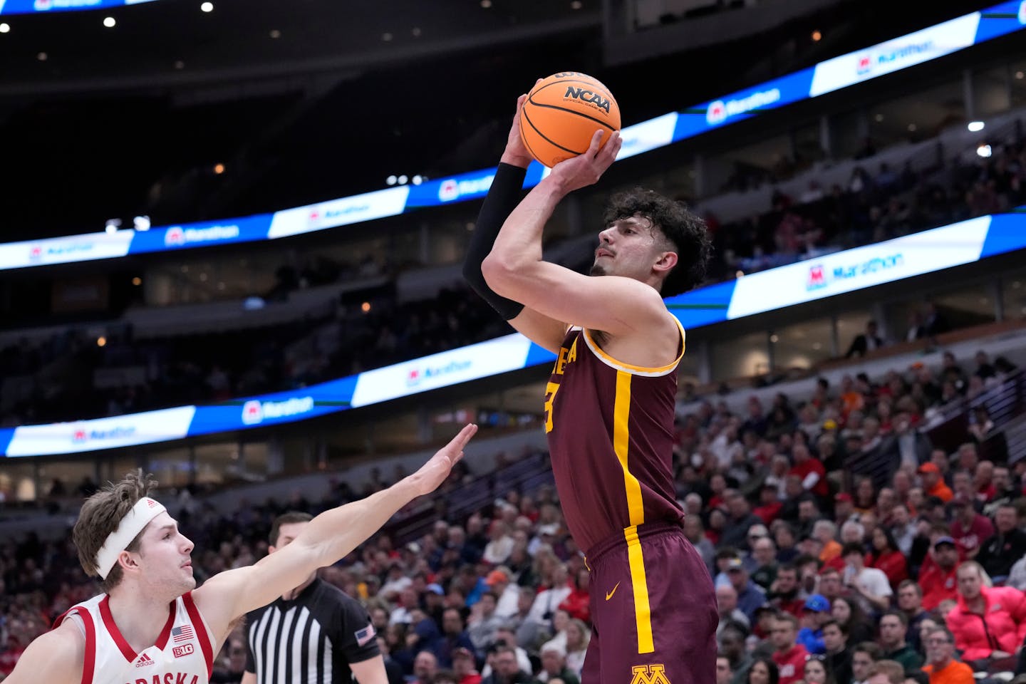 Minnesota's Dawson Garcia shoots as Nebraska's Sam Hoiberg defends during the first half of an NCAA college basketball game at the Big Ten men's tournament, Wednesday, March 8, 2023, in Chicago. (AP Photo/Charles Rex Arbogast)