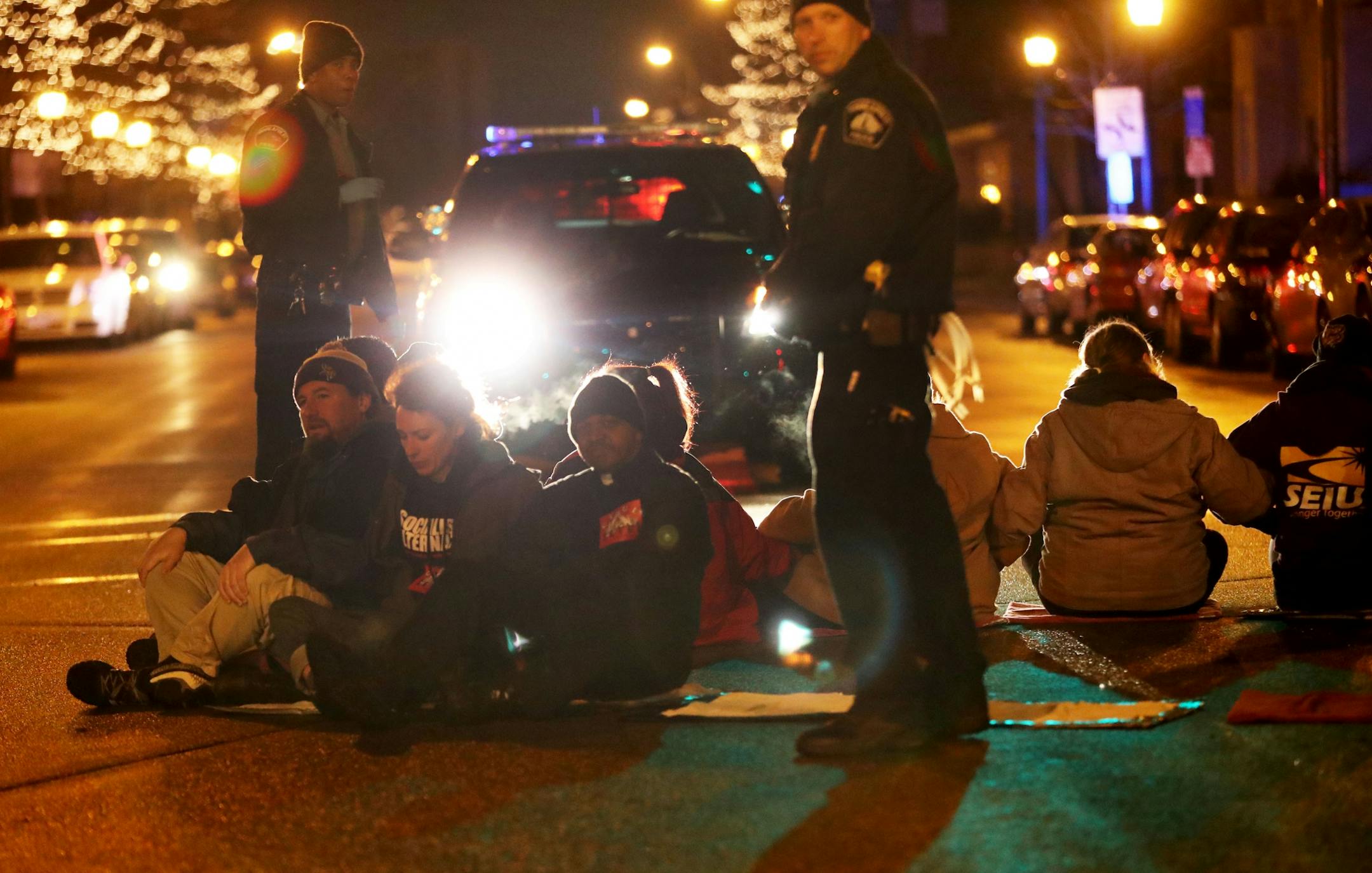 Protestors for Nationwide Fight for $15 Day of Disruption gathered outside McDonald's at 24th St. E. and Franklin Avenue, where for about a half hour protestors sat in a circle and blocked the intersection until they were arrested by Minneapolis police Tuesday, Nov. 29, 2016, in Minneapolis, MN. Here, protestors blocked the intersection at 24th St. E. and Franklin Ave. before being taken into police custody. Those arrested were ticketed and released.