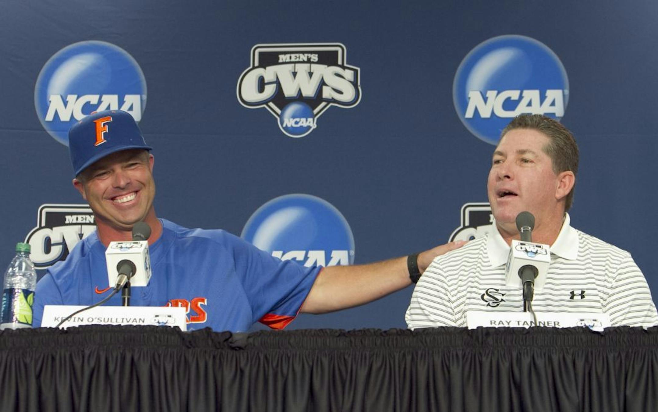 Florida baseball coach Kevin O'Sullivan, left, and South Carolina coach Ray Tanner participated in a news conference in Omaha, Neb., on Sunday, ahead of the NCAA College World Series best-of-three finals.