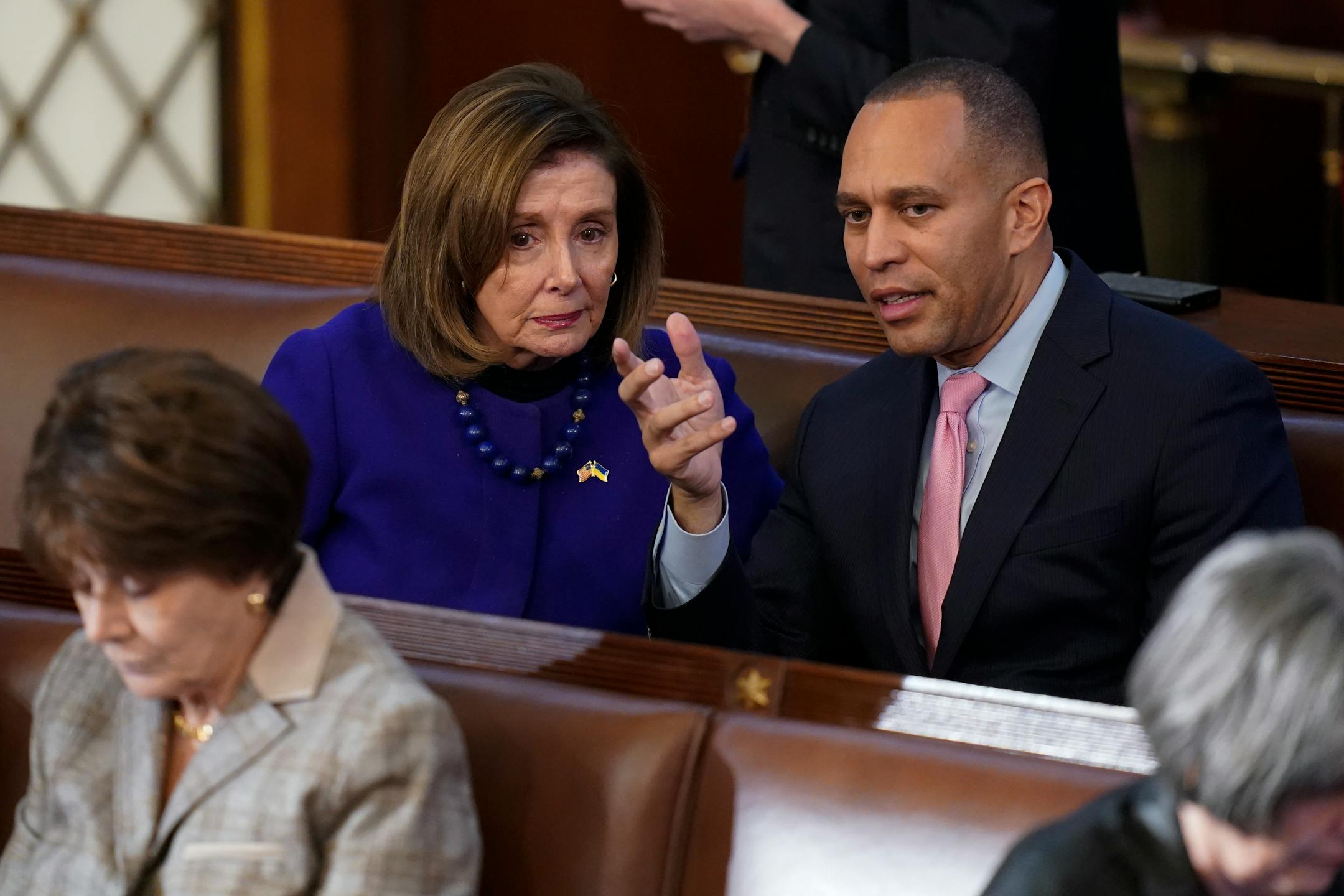 Rep. Hakeem Jeffries, D-N.Y., right, talks with Rep. Nancy Pelosi, D-Calif., during the eighth vote in the House chamber as the House meets for the third day to elect a speaker and convene the 118th Congress in Washington, Thursday, Jan. 5, 2023. (AP Photo/Alex Brandon)