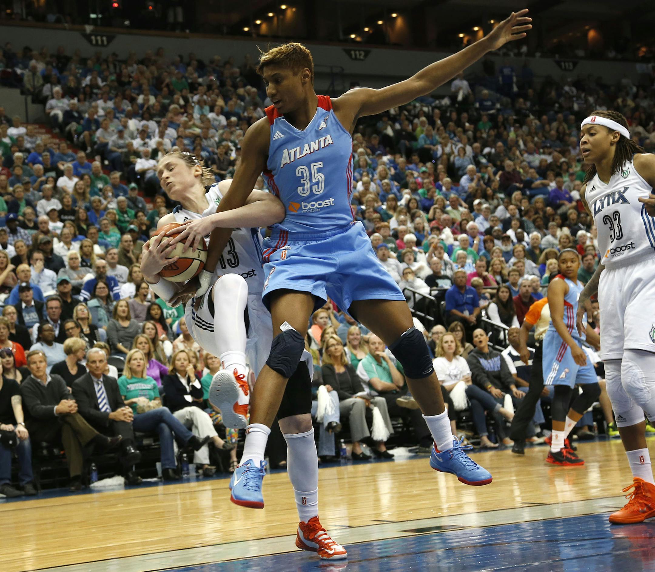 Lindsay Whalen #13 of the Minnesota Lynx got fouled by Angel McCoughtry #35 of the Atlanta Dream during the fourth quarter of Game 2 of the WNBA Finals at Target Center in Minneapolis, Min., Tuesday, October 8, 2013 Lynx won 88-63. ] (KYNDELL HARKNESS/STAR TRIBUNE) kyndell.harkness@startribune.com