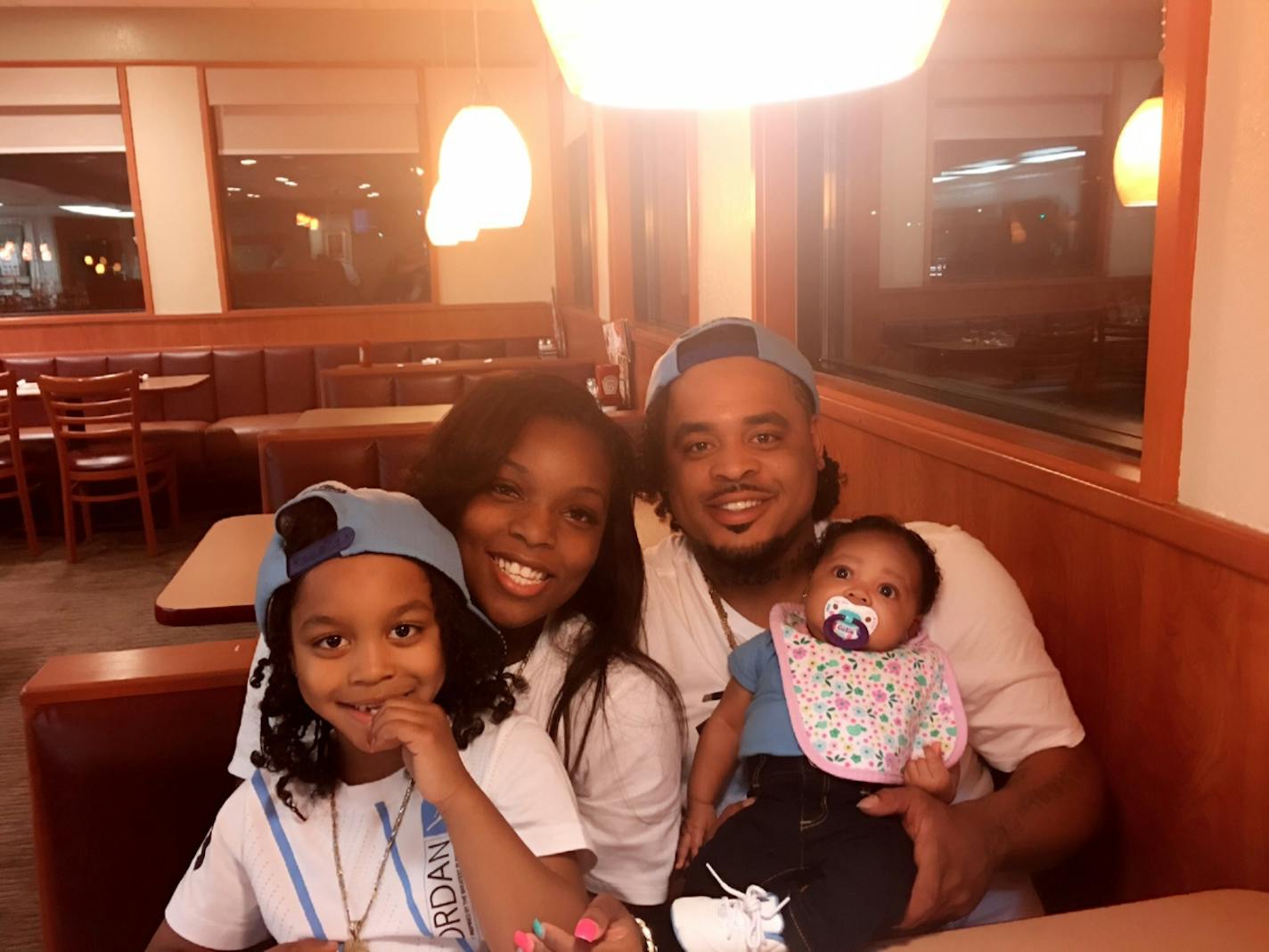 Chad Robertson of Minneapolis, pictured with his girlfriend and two children, was shot and wounded by an Amtrak police officer in Chicago Wednesday.