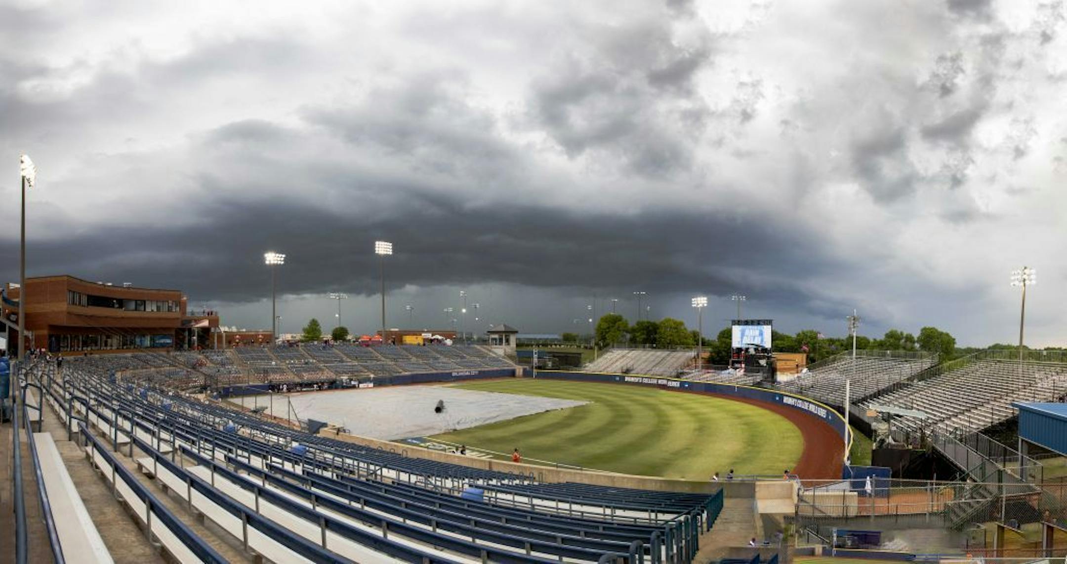 A severe thunderstorm moves and creates a weather delay during the sixth inning of a game between Minnesota and Washington at the Women's College World Series at ASA Hall of Fame Stadium in Oklahoma City on Saturday, June 1, 2019. Photo by: Alonzo J. Adams