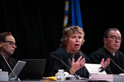 Associate Justice Anne K. McKeig asks questions as the Minnesota Supreme Court hears oral arguments in the case Cruz-Guzman v. State of Minnesota inside the auditorium at Richfield High School.