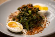 Grilled asparagus, with ranchovy, egg, and potato crunch, as prepared by chef Denny Leaf-Smith at All Saints.