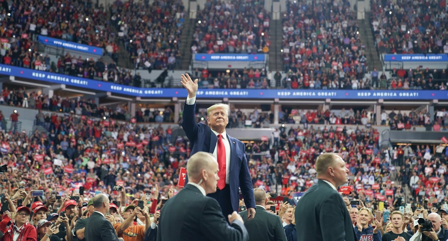 President Donald Trump greeted cheering crowds at the Target Center in Minneapolis, Minnesota.