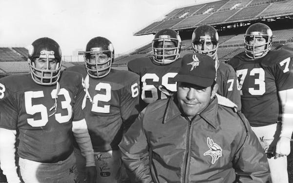Steve Riley, second from right, was part of a Vikings offensive line coached by John Michels, front, in 1976. From left, Mick Tingelhoff, Ed White, Ch