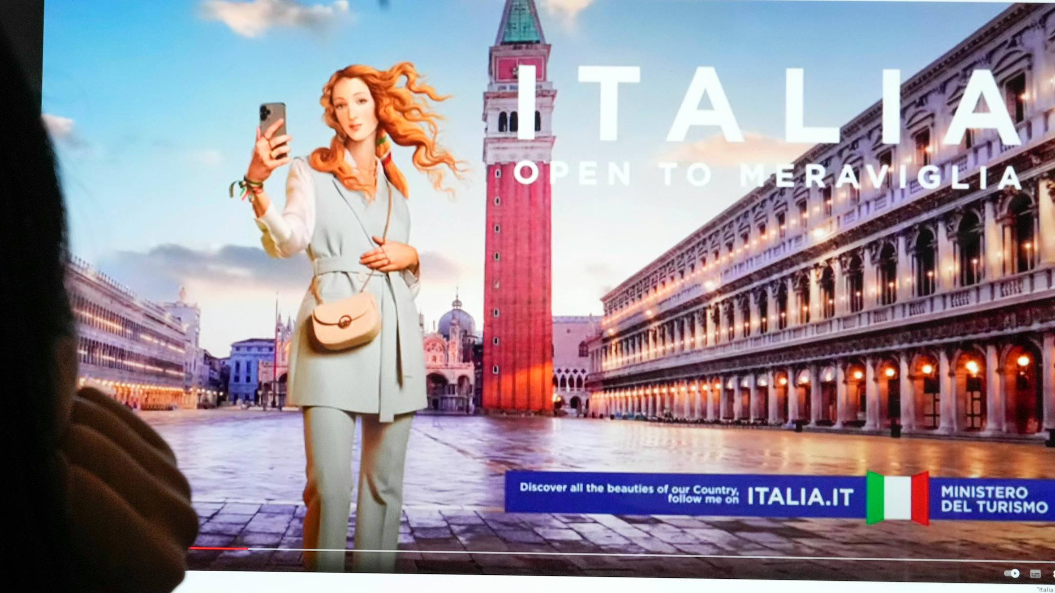 People watch on a computer monitor the latest Italian Ministry of Tourism nine-million-euro campaign showing Botticelli's Venus depicted as a virtual influencer in Rome, Wednesday, May 3, 203. A nine-million-euro advertising campaign by Italy's conservative government that has transformed "The Birth of Venus," painted by Renaissance master Sandro Botticelli in Florence around 1485, into a virtual influencer has met with widespread derision. (AP Photo/Gregorio Borgia)